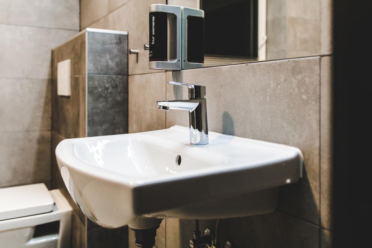 Silesia Residence Ostrava Extérieur photo A soap dispenser mounted above a sink